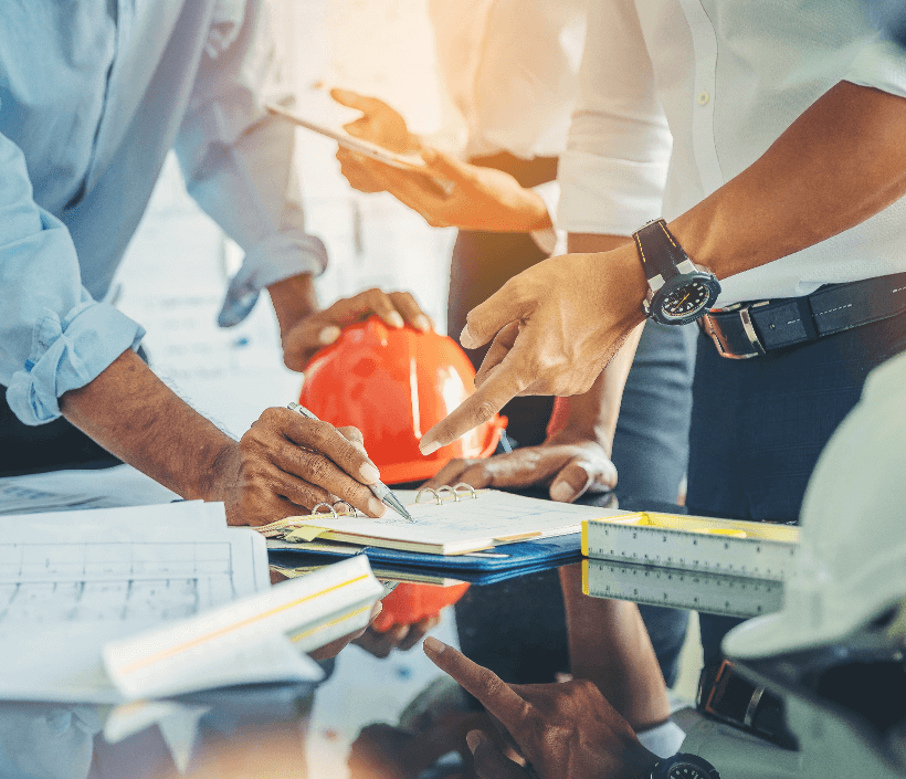 contractor-engineer-with-blueprints-discuss-modern-construction-site-engineers-mechanical-factory-reading-instructions